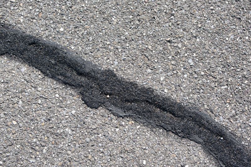 Cracked Asphalt Before Sealing